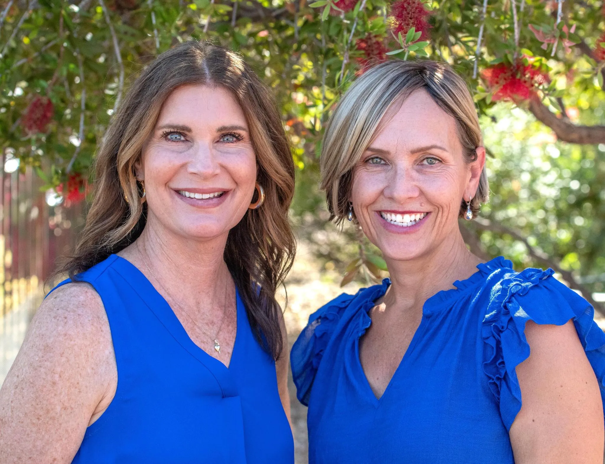 Amanda and Kristine of A Senior Journey, smiling together outdoors in Tucson