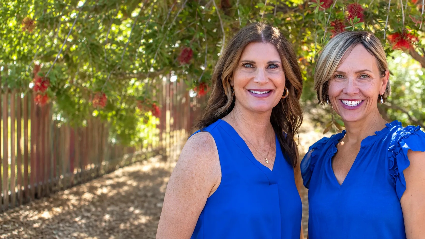 Amanda and Kristine of A Senior Journey, smiling together outdoors in Tucson